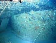 The sunken turret now lies upside down beneath the ship's hull (Photo: NOAA)
