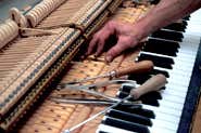 Hot-wired piano tunes itself