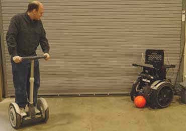 Robotic Segways play soccer with humans