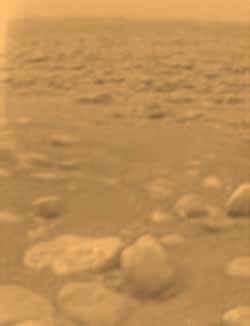 Pebbles on Titan show some evidence of erosion, the moon's colour appears orange 