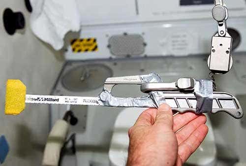 The hacksaw to be used by Robinson has been modified to make it easier and safer to use