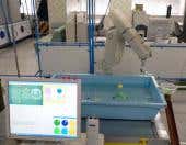 Kids battle robot in goldfish-catching contest