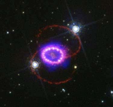 Optical hotspots glow pearly pink as the supernova's shock wave slams into cool, dense fingers of gas on the edge of a cavity surrounding the exploded star