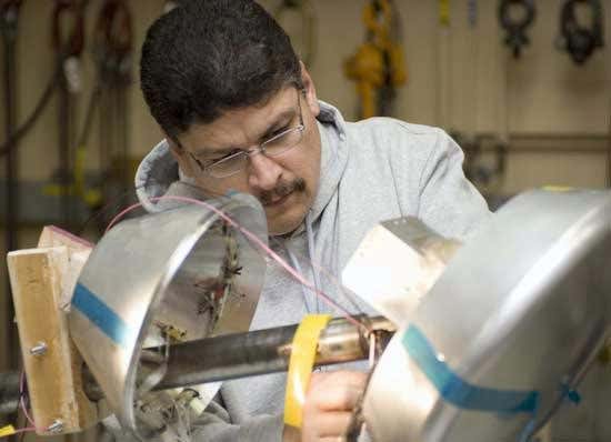 Engineers prepare a scale-model of the Crew Exploration Vehicle for a series of wind-tunnel tests (T Trower/Ames/NASA)