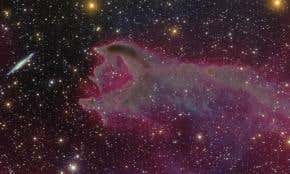 Cosmic 'eel' preys on spiral galaxy