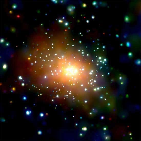 This Chandra image, in which X-ray energy is colour-coded (red = low, green = medium, blue = high), shows the central region of Andromeda, where a diffuse, X-ray emitting cloud of hot gas was discovered