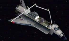 Astronauts begin shuttle heat shield inspection