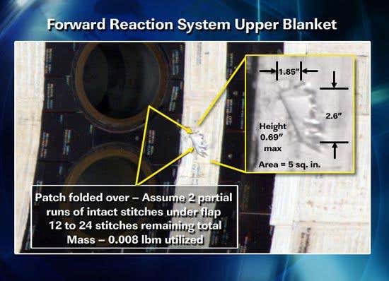 NASA engineers examined a piece of insulating blanket poking out from Discovery