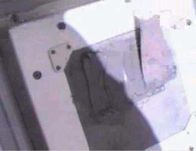 This panel has been smeared with NOAX, a sealant that resembles grey peanut butter 