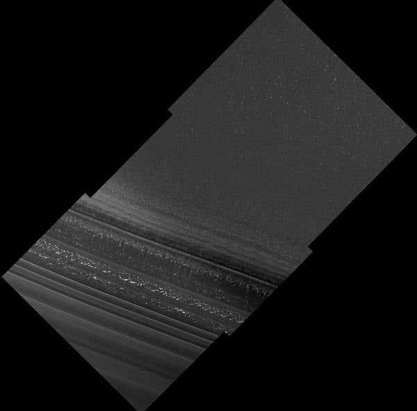 Layered deposits of ice and dust appear in this image showing terrain near Mars's north pole. Bright flecks are probably patches of water ice frost on the surface