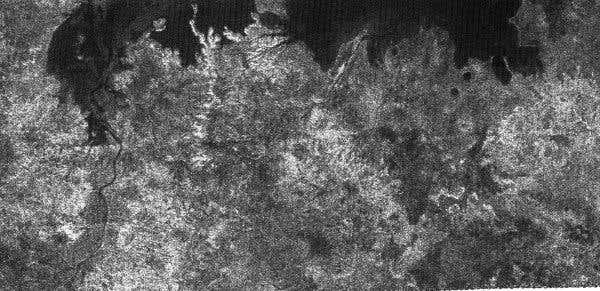 A large lake about 100 kilometres across appears at top right. A long channel appears to drain into the lake to its left 