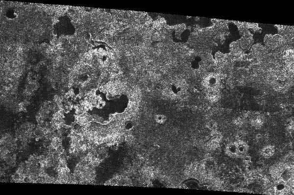 Methane or ethane lakes show a variety of shapes in this Titan radar image. Several have a nested appearance that suggests they are volcanically collapsed areas called calderas. Radar bright material that rings some of them may be icy debris from past eruptions 