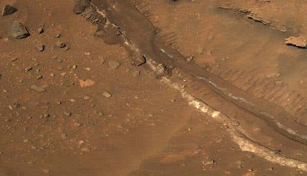 Scientists hope to further investigate light-coloured sulphates churned up by Spirit's wheels. The sulphates are thought to have formed in the presence of liquid water