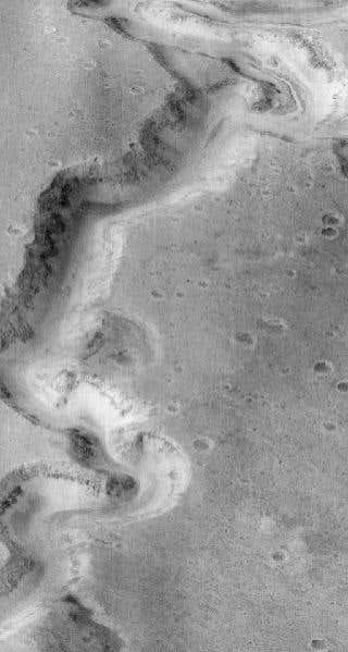 A winding canyon called Nanedi Vallis seen here in an image from NASA's Mars Odyssey spacecraft is one of many features on the planet's surface that suggest past water flow