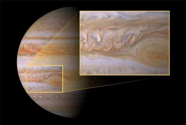 The Cassini spacecraft snapped this image of the turbulent atmosphere northwest of the Great Red Spot. New Horizons found calm skies when it recently photographed the area