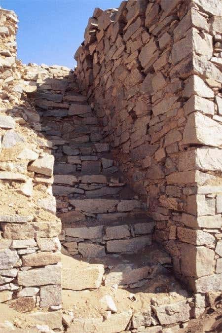 A staircase leads up to Tower 1