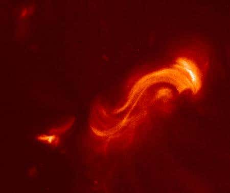 S-shaped magnetic loops such as this one on the Sun are more likely than loops of other shapes to unleash radiation and charged particles, which can damage satellites around Earth. Hinode's X-Ray Telescope took this image 