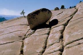 Balancing boulders with a shaky past