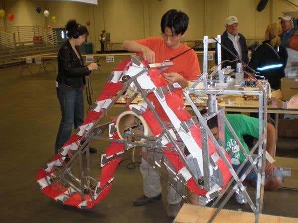Masafumi Iai, a student at the University of Missouri at Rolla, makes adjustments to the Lunar Miner, his team's entry in the competition