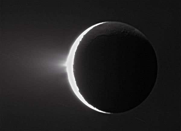Ice is flung from the south pole of Enceladus, one of Saturn's moons, in this unprocessed picture taken by the Cassini spacecraft in 2007 