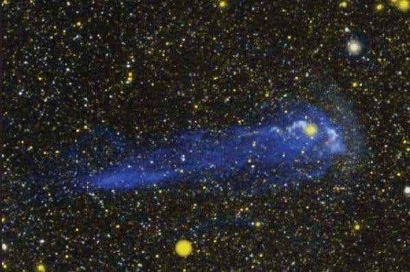 A close-up reveals details of the tail where it begins around the Mira star system 