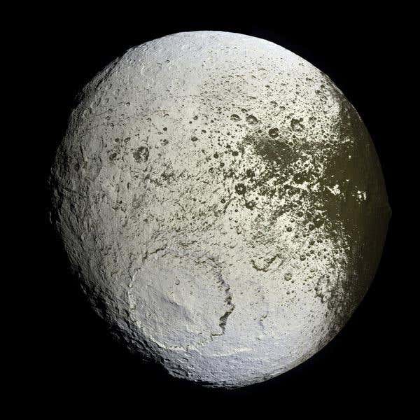 Cassini captured the first high-resolution glimpse of the bright trailing hemisphere of Iapetus in September 2007