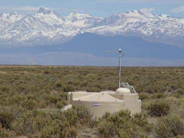 The Auger Observatory in Argentina detects energetic particles through their interaction with water in surface detector tanks (shown). It also uses telescopes to observe how incoming cosmic rays make the atmosphere fluoresce 