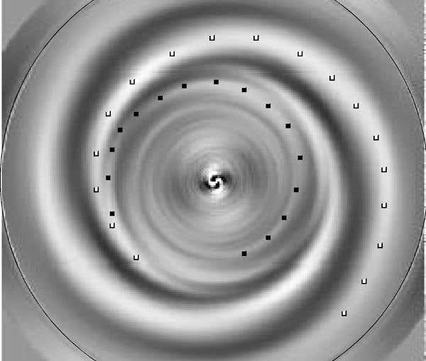 A new analysis of the Hubble image reveals two new inner arms (one of which is marked with black dots) that trail the direction of the galaxy's rotation. One of the outer arms, which are wrapped in the opposite direction, is marked with white dots (Illustration: G Byrd et al.)