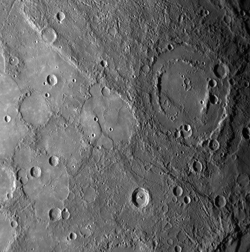 Sharp cliffs and escarpments visible on the close-up images may indicate that the whole planet shrank as it cooled