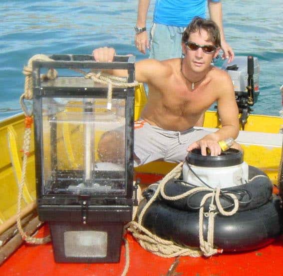 Team member Steve Simpson with the light trap and sound system used to collect larval fish as they return to reefs. The larval fish preferred the traps broadcasting noises made by invertebrate food sources