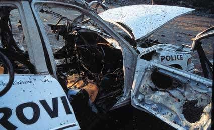 Blast damage to a police car following a simulated suicide bombing