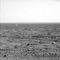 The white object in the distance is the lander's backshell 