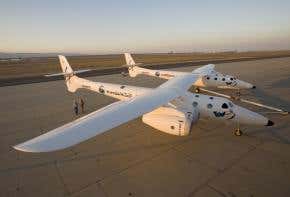 Virgin Galactic rolls out SpaceShipTwo's 'mothership'