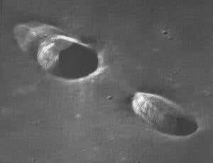 Mars craters might be scars from fallen moon