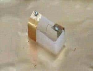 Tiny boat skims over water like a bug