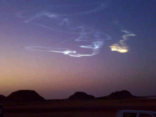 This image of the wind-blown trail left behind after the asteroid 2008 TC3 hit the atmosphere was taken by a cellphone