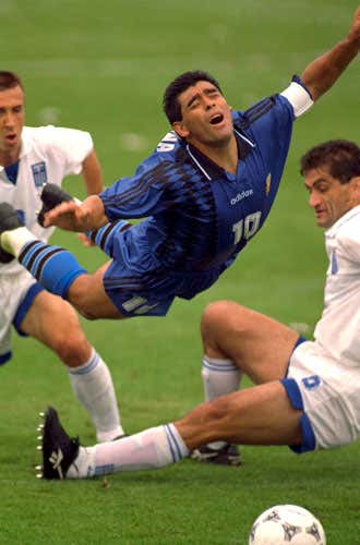 Diego Maradona flies dramatically through the air after a Greece challenge in the 1994 World Cup 