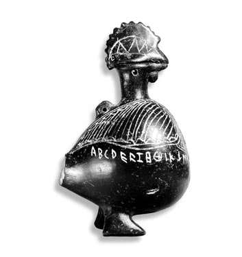 An Etruscan vase or inkwell in the shape of rooster, from Viterbo, circa 600 BC. It is inscribed with the letters of a