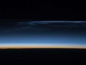 The crew of the International Space Station snapped this image of high-flying noctilucent clouds on 22 July 2008, as the station passed over western Mongolia