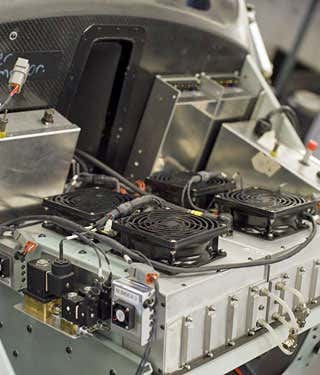 Under the hood a fuel cell constantly trickles power into a bank of ultracapacitors that are also charged by the motors capturing energy lost during braking