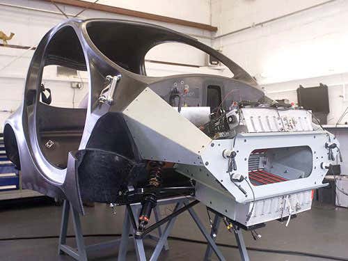 The car's frame is largely carbon fibre, allowing the total weight of a complete vehicle to be just 350kg