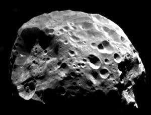 When Saturn's moon Phoebe (shown) is hit by wayward interplanetary bodies or rocky debris in orbit around Saturn, the impacts generate detritus that likely fills the newly found dust ring