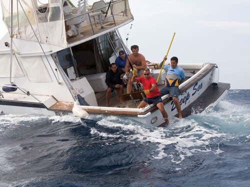 Pablo Cermeño (with harpoon) prepares to tag another tuna 