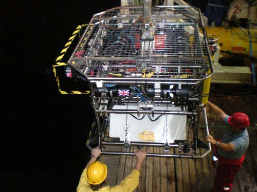 The Hy-Bis underwater vehicle is launched from the deck of the Jame Cook