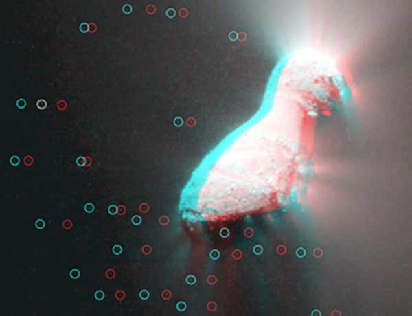 Images from Deep Impact's Medium Resolution Instrument were combined to give this 3D view of Hartley 2's nucleus and surrounding cloud of snowballs (circled) 