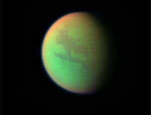 Ethane lakes in a red haze: Titan's uncanny moonscape