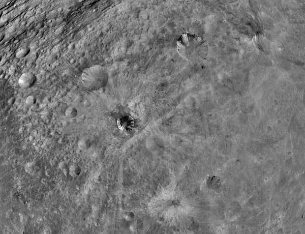No one is sure what causes the dark streaks visible in some of the craters shown here 
