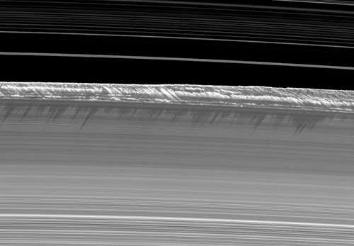 Moons gliding past the planet's icy rings trigger the formation of mountain-sized snowballs that might become new satellites 