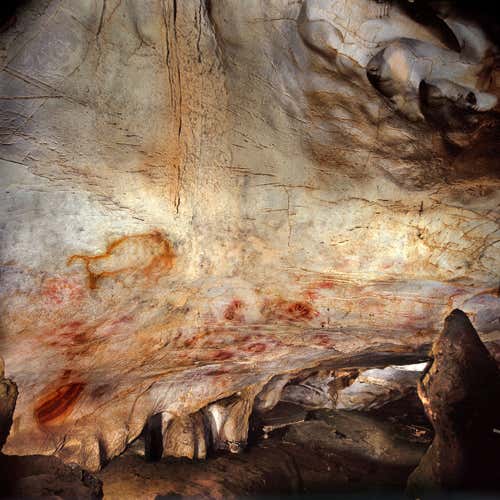 Zoomed-out view of the cave art in El Castillo cave, Spain 