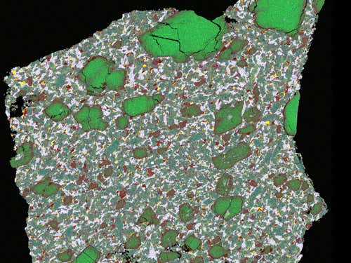 Iron is red and magnesium green in this false-colour image